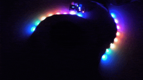 An LED strip on a robot running a rainbow chase in the dark